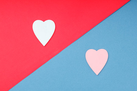 the color-separated areas are blue and red, with two heart symbols on them. Blue and red heart on a blue and red fieldの写真素材