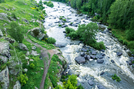 landscape view from a drone to a mountain river, streams of water and stones on the river. landscape...