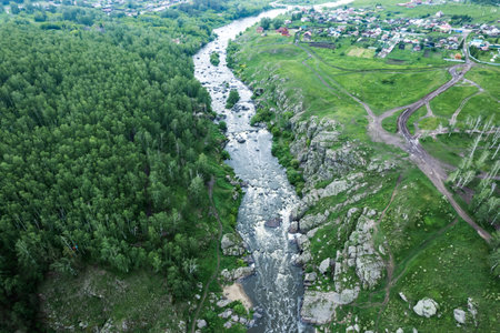 village and river in a forest area on a summer day, drone view. summer landscape drone view of the...