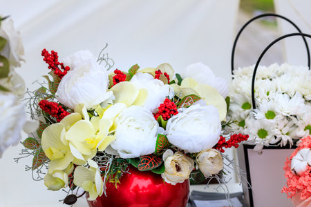 bouquets for sale on a showcase on a light background. bright flowers in a bouquetの写真素材