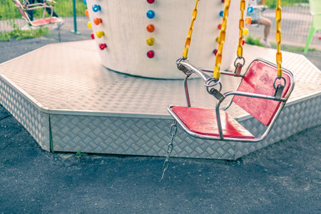 old carousel in the park, empty space. wooden seat on an old carousel. childhood memoriesの写真素材
