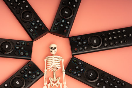 control panels are located around the skeleton, the person becomes sedentary. brought to the death of a person by the media and TVの写真素材