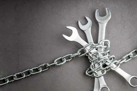 the wrenches are connected by a metal chain. prohibited tools