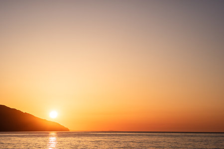 seascape evening coast on the Black Sea. The orange color of a sea sunsetの写真素材