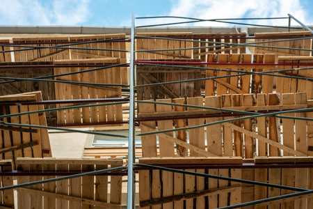 scaffolding at the building where the facade is being repaired. building repairs and scaffolding bottom viewの写真素材