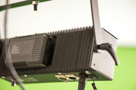 A black light fixture with a black box on the bottom. The box has a label.の写真素材