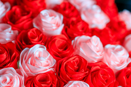 white and red roses are artificial flowers. photos of flowers that are created from the ribbonの写真素材