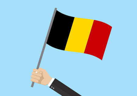 Belgium waving flag. Hand holding Belgian flag. National symbol. Vector illustration.のイラスト素材
