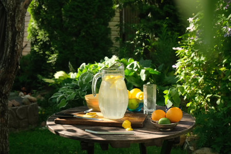 Jug of homemade lemonade outdoors. Refreshing summer citrus beverage.の写真素材