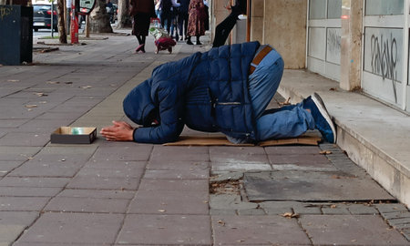 Homeless beggar begging for money and food image. Person begging strangers for help image. Miserable...