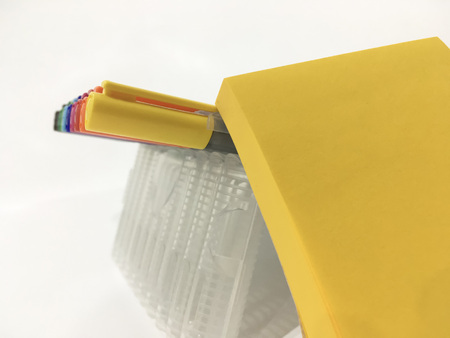 Colorful magic pen with post it use for summarizing and easily remember in yello theme on white backgroundの写真素材