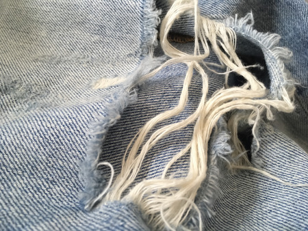 Old rip blue jeans,blue destroyed denimの写真素材