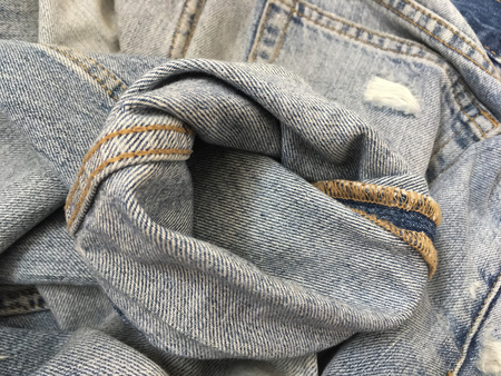 Pinroll cuff of rip old blue jeansの写真素材