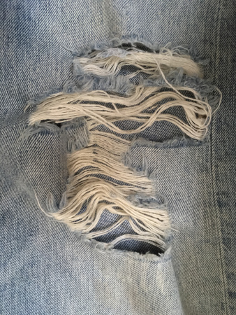 Old rip blue jeans,blue destroyed denimの写真素材