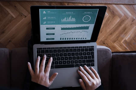 young woman typing on notebookのeditorial素材