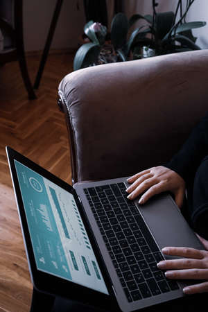 young woman typing on notebookのeditorial素材