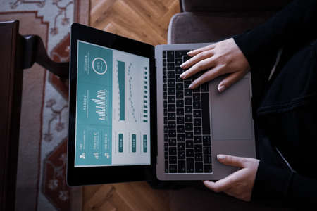 young woman typing on notebookのeditorial素材