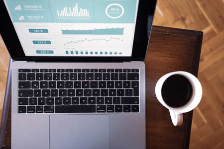 notebook on table with coffeeのeditorial素材