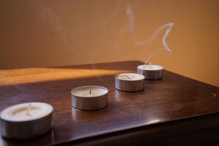 candles, tea lights and smoke on it