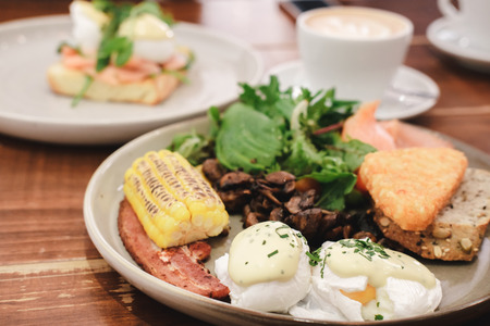 A breakfast platter with a cup of coffeeの写真素材