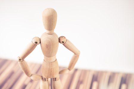 timber figure standing confidentlyの写真素材