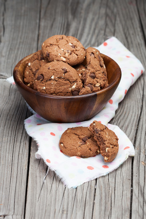 Homemade chocolate chip cookies on old wooden backgroundの写真素材