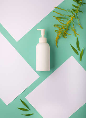 Minimal background for branding and product presentation. Cosmetic bottle on blue table. Body wash...