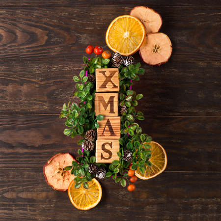 Zero waste Christmas concept. Natural Chirsmas decoration, pine cones and branches on dark rustic...