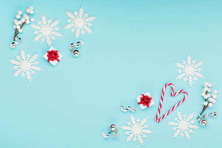 Christmas holiday winter New Year festive card. Xmas red gift boxes, snowflakes, candy canes on...