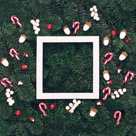 Christmas holiday winter New Year festive card. Xmas red and white decorations, empty white frame,...