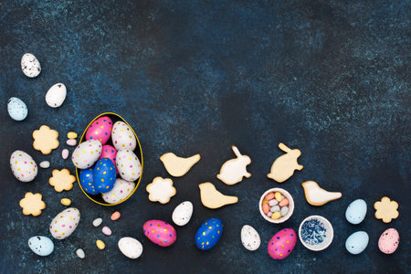 Festive Easter holiday greeting card background. Cute homemade Easter cookies, chocolate eggs, sugar...