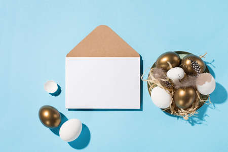 Festive Easter holiday greeting card template. Easter golden eggs, quail eggs, feathers and empty...