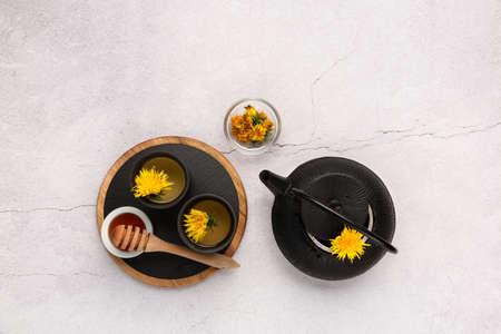 Healthy herbal tea, honey and black teapot