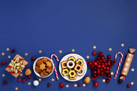 Saint Nicholas Day, 6 December. Christmas composition with sweets, candy, gingerbread cookies and...