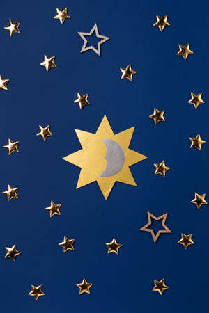 Winter solstice day holiday, December 21. Longest night in the year concept. Sun, moon and golden...