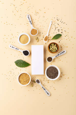 Healthy food clean eating concept. Assortment seeds, superfood on beige paper background. Set of sesame, flax seed, chia, hemp seeds, amaranth. Top view, copy space.の写真素材