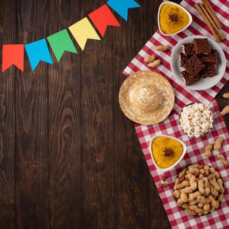 Festa Junina Summer Festival Carnival concept. Brazilian straw hat, popcorn, peanuts and colorful...