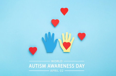 World Autism Awareness Day or month concept. Creative design for April 2. Colorful hands on blue background, symbol of awareness for autism spectrum disorder.の写真素材