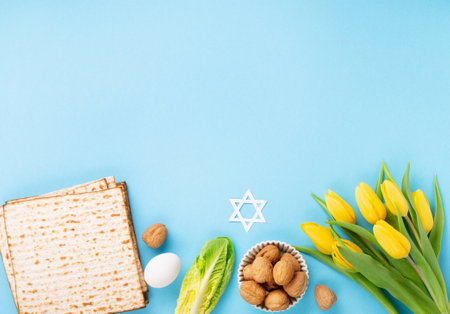 Jewish holiday Passover greeting card concept with matzah matzoh (jewish holiday bread), walnuts,...