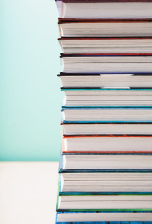 World book and Copyright day, Education concept. Stack of books on blue mint background. Festive card for books holiday, copy space.の写真素材
