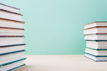 World book and Copyright day, Education concept. Stack of books on blue mint background. Festive card for books holiday, copy space.の写真素材
