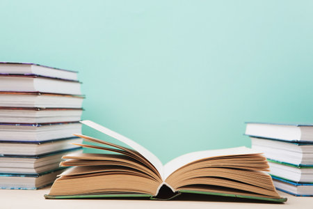 World book and Copyright day, Education concept. Stack of books on blue mint background. Festive card for books holiday, copy space.の写真素材
