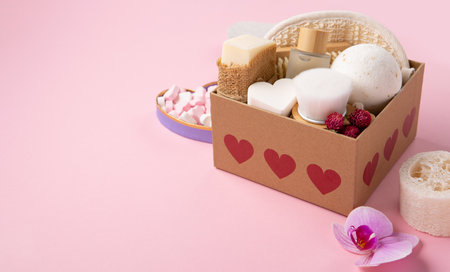 Eco friendly self care gift package for mothers day, womans, valentines day. Natural eco friendly beauty skin care products concept. Zero waste bathroom, spa accessories on pink background.の写真素材