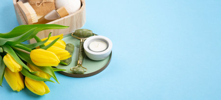 Natural eco friendly beauty skin care products, spa accessories for women and spring tulip flowers on blue background. Zero waste self care heart shape gift box for Mothers day, womans day, birthday.の写真素材