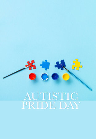 Autistic Pride Day or World Autism Awareness Day concept. Puzzles, symbol of awareness for autism spectrum disorder and colorful paints on blue background. Top view, copy space.の写真素材