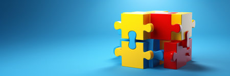 World Autism Awareness Day or month concept. Creative design for April 2. Blue, red, yellow jigsaw puzzles, symbol of awareness for autism spectrum disorder on blue background, copy space.の素材