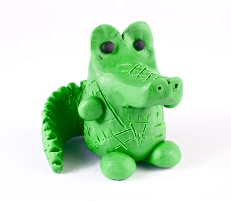Plasticine crocodile isolated over whiteの写真素材