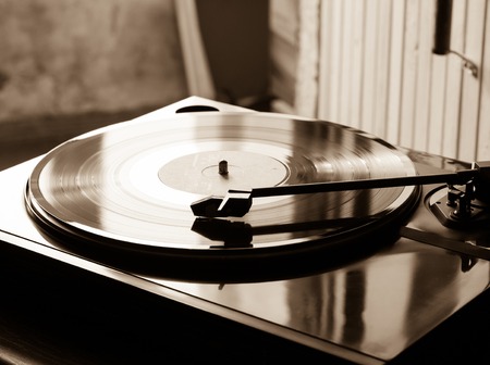 Vintage record player with vinyl disc, close-up.の写真素材