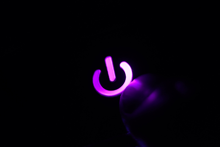 power button with your finger. close-upの写真素材