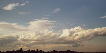 landscape sky with clouds on the background of the field.の写真素材